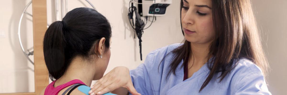 Sports medicine doctor working with patient