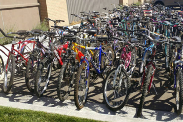 1000 donated bikes in front of a PHMG clinic
