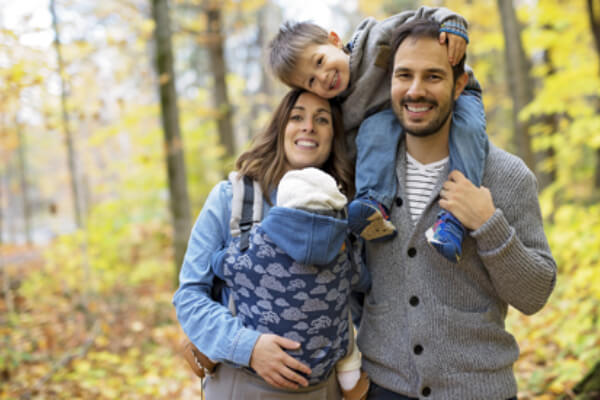 young family with kids in the outdoors, flu season, flu vaccine concept