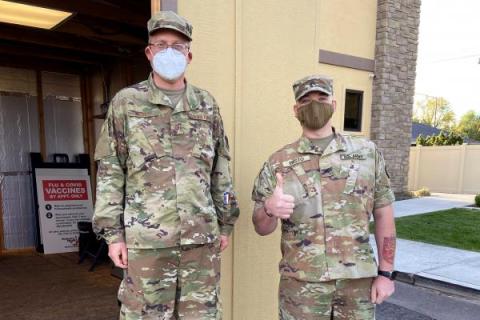 Idaho National Guardsmen stand outside a Primary Health clinic