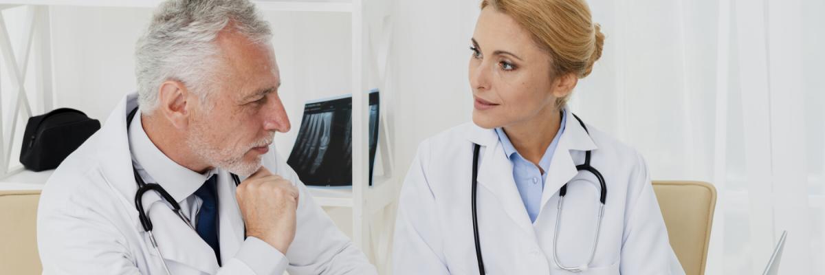 Doctors doing research on laptop