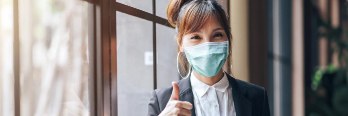 Young adult woman wearing a mask, safety from illness and Coronavirus